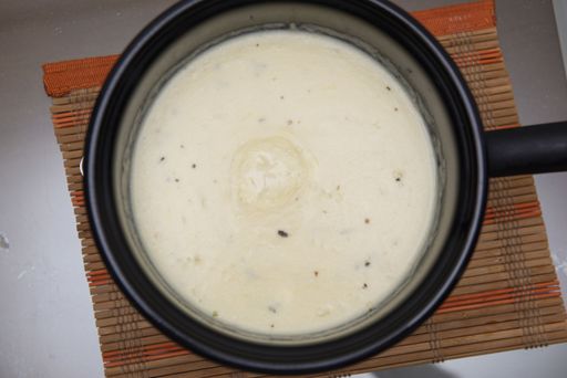 A high angle shot of a vichyssoise soup in a cooker