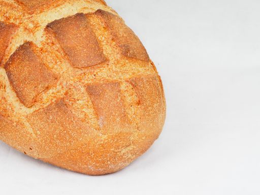 A closeup shot of a freshly baked bread isolated on a white background