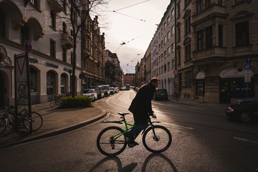 Cyclists enjoy the warm spring in Munich. Cycling common in the city