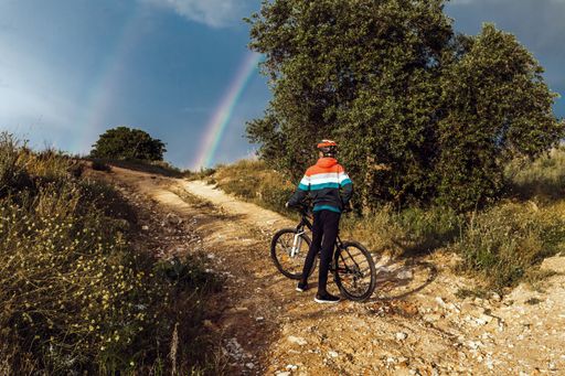 A beautiful shot of a male biker in the countryside in Spain