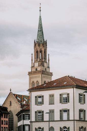 A vertical shot of an old historic buildings and a church tower in Saint Gallen