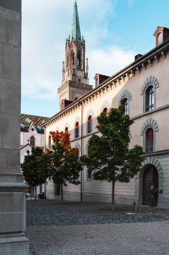 A vertical shot of an old historic buildings and a church tower in Saint Gallen
