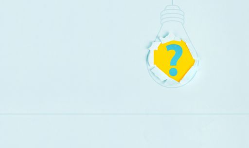 Question mark in light bulb, having an idea, marketing and business concept, brainstorming for new goals, torn paper
