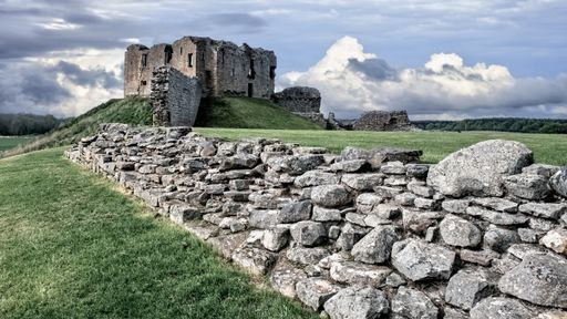 A view of a castle situated on the Laich of Moray near Elgin during daytime