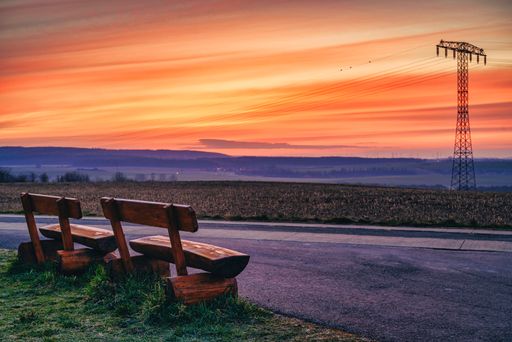 Park bench with a view of the sunrise with a wonderful dawn