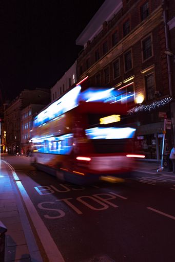 Vertical shot of a moving London bus in Oxford at night