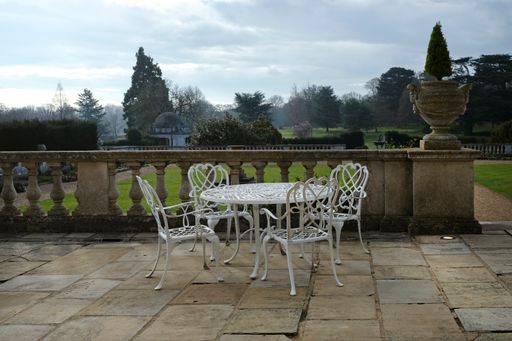 A beautiful shot of an English country house under the cloudy sky