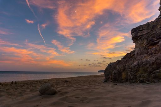 The scenic view of Figueira beach against red clouds in the sky at sunset in Portugal