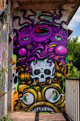 A mural of monsters in the abandoned city of Consonno, Italy