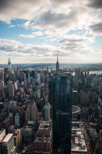 A vertical view of beautiful high buildings in New York on a sunny day