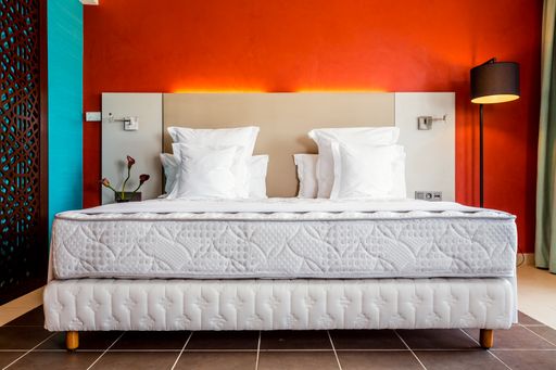 Empty modern double bed hotel room