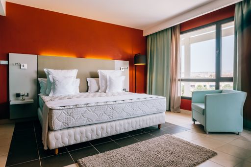 Empty modern double bed hotel room