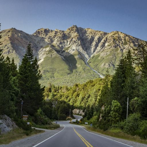 A beautiful shot of a road with mountains in the background