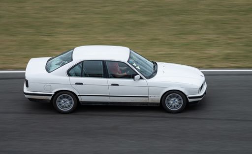 White Modified sports car, it's a BMW E34