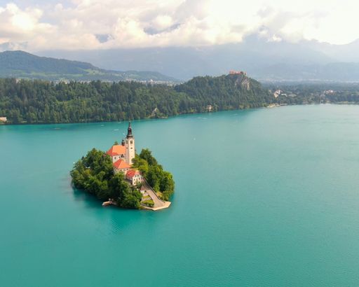 An aerial view of the Assumption of Maria Church on island on lake Bled in Slovenia