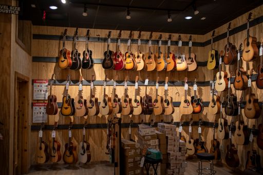 Augusta, Ga USA - 10 18 21: Guitar Center interior front view wall of guitars