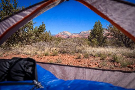 A natural view of the Sedona Red Rocks seen from a tent