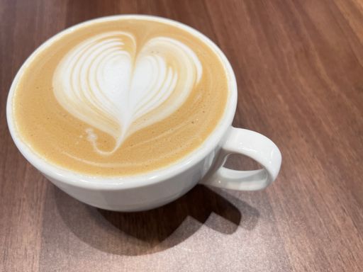 A close-up shot of a beautiful latte art in a mug.