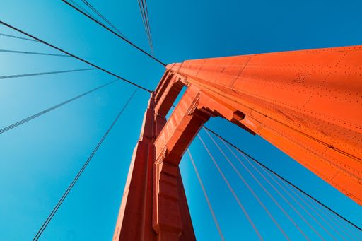 A low angle shot of the Golden Gate Bridge against the blue sky, San Fransico, California, USA