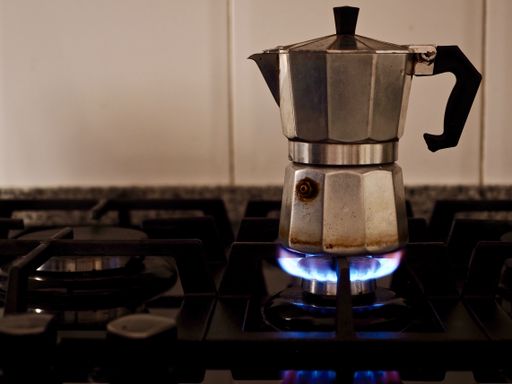 espresso coffee in the making, on a gas hob