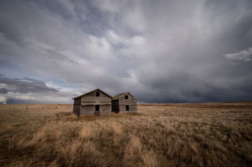 Abandoned farm buildings in Alberta in early Spring.