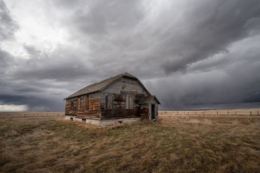 Abandoned farm buildings in Alberta in early Spring.