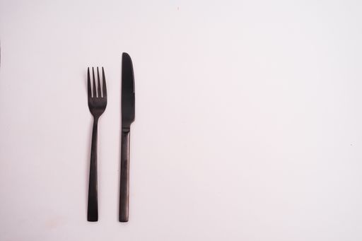 A knife and a fork isolated on a white background