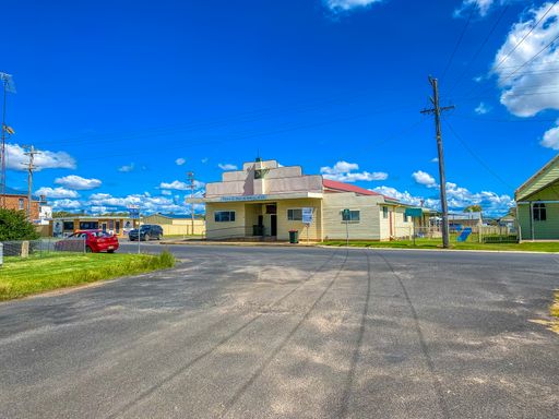 A beautiful view of an old town hall under a blue sky in Emmaville, Australia