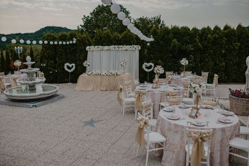 A beautiful shot of a decorated outdoor wedding ceremony reception