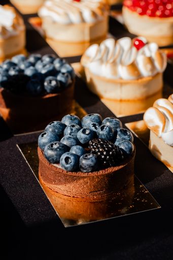 The close-up of blueberry chocolate tart, vertical