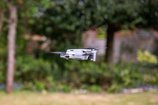 The close-up of a lightweight drone hovering in the air