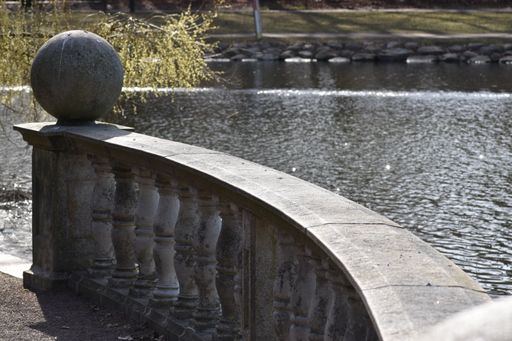 A beautiful view of a park embankment near a river on a sunny day