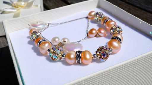 A shot of a pearl bracelet in a white box