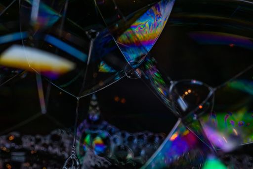 A closeup shot of soap bubbles with rainbow colors in it