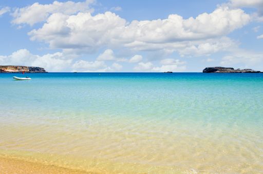 The sandy Martinhal beach in Sagres, Algarve, with calm and crystal clear waters