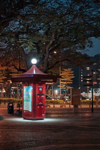 A vertical night shot of cute red mailbox in Macau, China