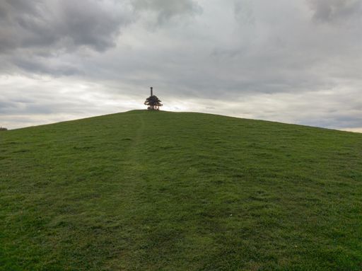 The war memorial Montgomery on the top of the hill with a cloudy sky in Powys, Wales