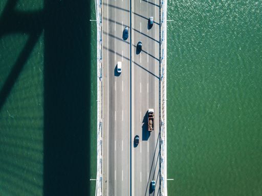 Top down view of a bridge over the sea in Lisbon, Portugal
