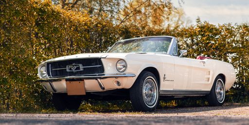 An old vintage Ford Mustang convertible classic car outdoors