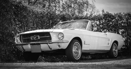 An old vintage Ford Mustang convertible classic car outdoors