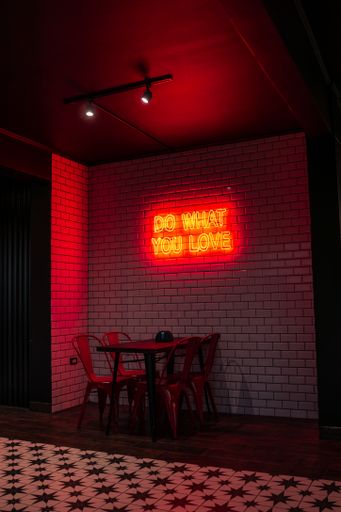 A vertical shot of "Do what you love" sign in a small restaurant in La Serena, Chile