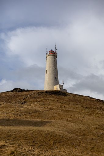 A vertical shot of the famous Reykjanes lighthouse in Iceland under a gloomy sky