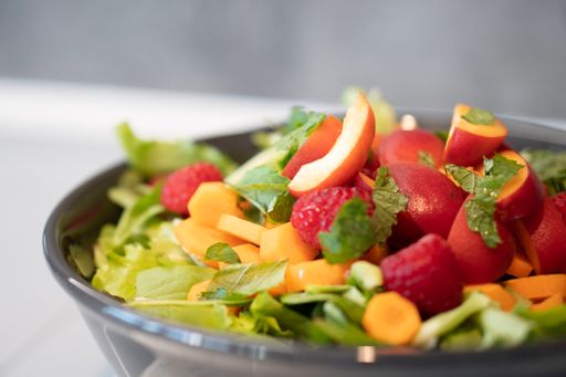 A closeup shot of fresh healthy salad with fruits