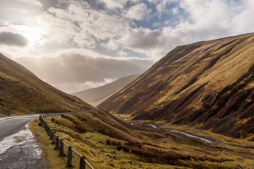 An aerial shot of beautiful mountains in Scotland, UK