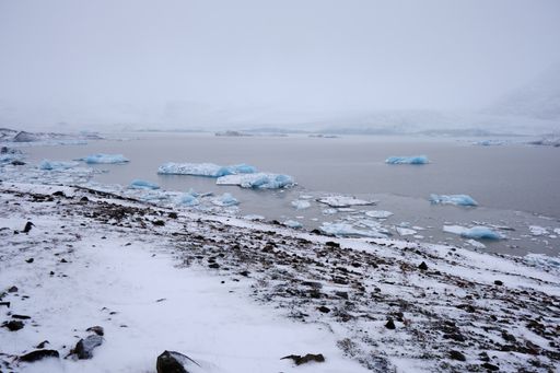 Wide angle view of Fjallsarlon Glacier Lake, Iceland showing many floating icebergs