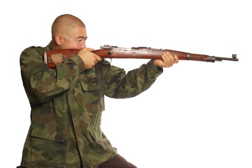 A man wearing camouflage holding a gun isolated on white background
