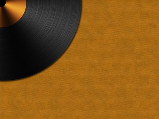 A gramophone record disc on an orange leather surface