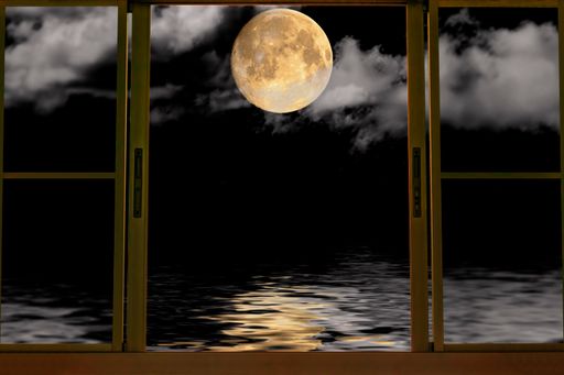 A beautiful view of the moon and shadow in the window