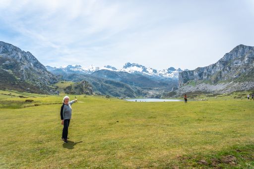 A beautiful shot of a Caucasian elderly woman visiting Lake Ercina in the Lakes of Covadonga, Asturias, Spain