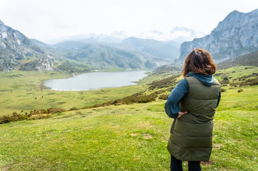 A young tourist enjoying the views at the Entrelagos viewpoint of Lake Ercina in the Lakes of Covadonga. Asturias. Spain
